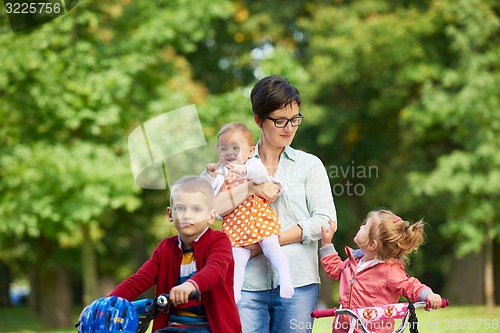 Image of happy young family in park