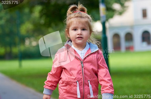 Image of little girl have fun in park