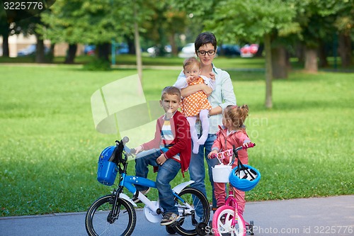 Image of happy young family in park
