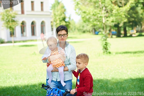 Image of happy young family in park