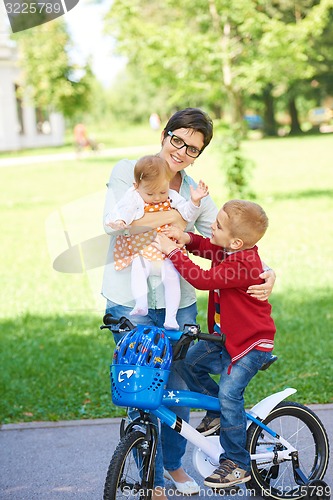 Image of happy young family in park