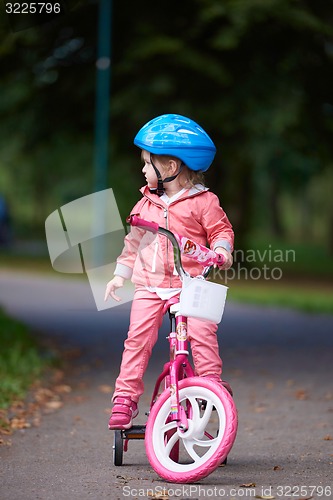 Image of little girl with bicycle