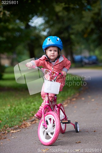 Image of little girl with bicycle