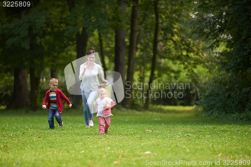 Image of happy family playing together outdoor in park