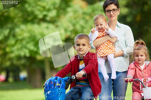 Image of happy young family in park