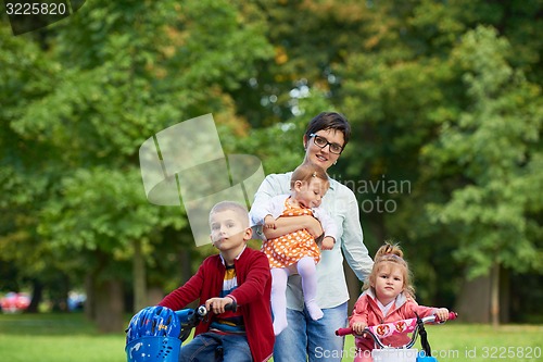 Image of happy young family in park