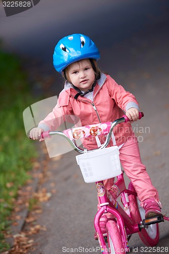 Image of little girl with bicycle