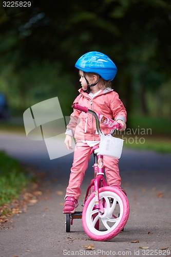 Image of little girl with bicycle