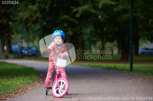 Image of little girl with bicycle