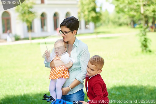 Image of happy young family in park