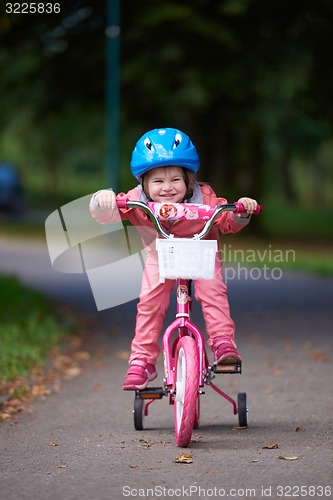 Image of little girl with bicycle