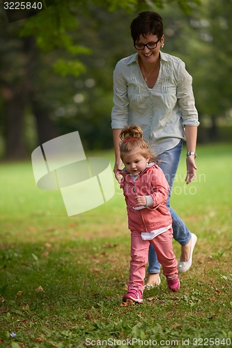 Image of happy family playing together outdoor in park