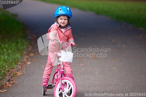 Image of little girl with bicycle