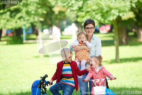 Image of happy young family in park