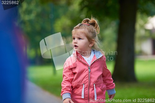 Image of little girl have fun in park