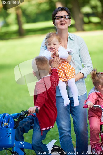 Image of happy young family in park