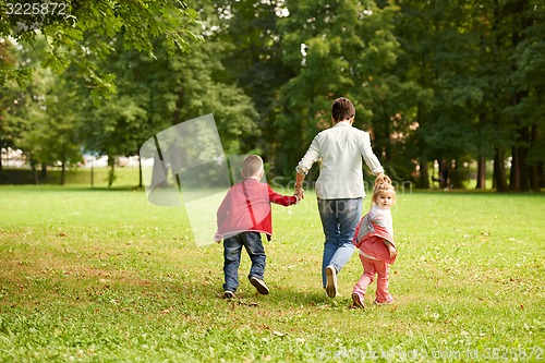 Image of happy family playing together outdoor in park