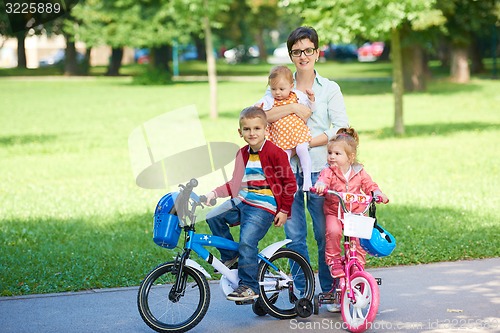 Image of happy young family in park