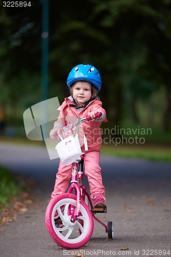 Image of little girl with bicycle