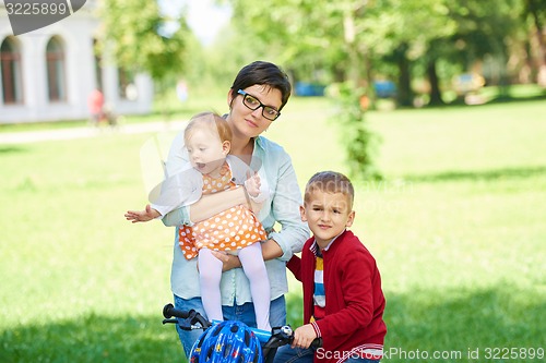 Image of happy young family in park