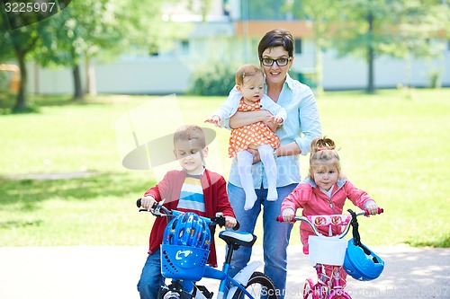 Image of happy young family in park