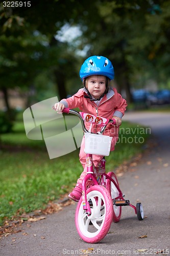 Image of little girl with bicycle