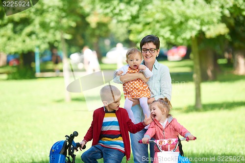 Image of happy young family in park