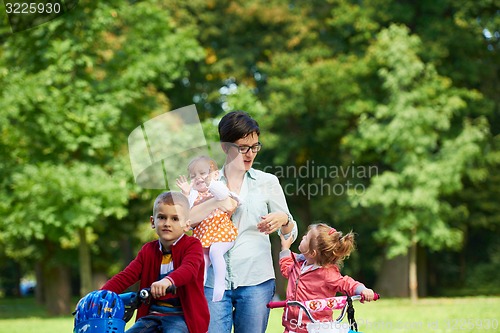 Image of happy young family in park