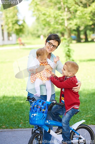 Image of happy young family in park