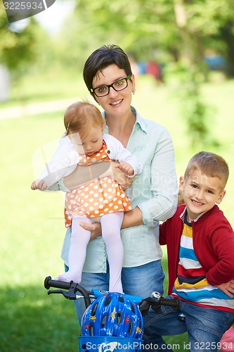 Image of happy young family in park