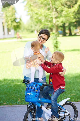 Image of happy young family in park