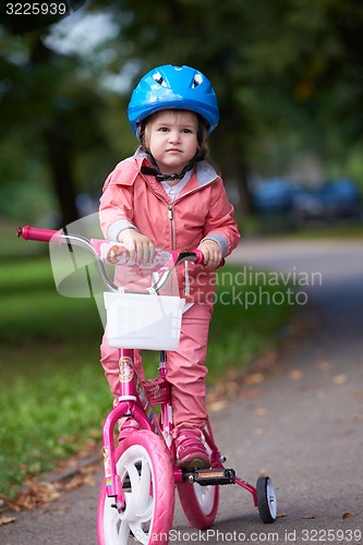 Image of little girl with bicycle