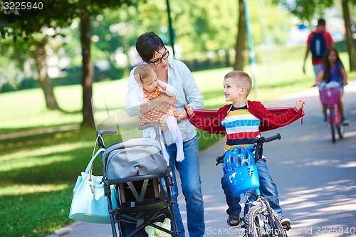 Image of happy young family in park