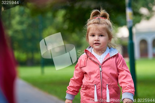 Image of little girl have fun in park