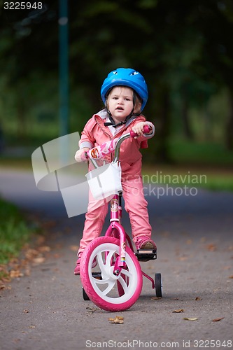 Image of little girl with bicycle