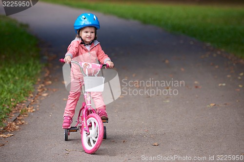 Image of little girl with bicycle