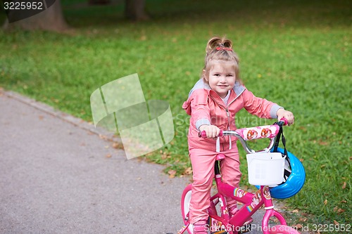 Image of little girl with bicycle
