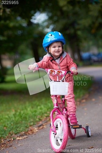 Image of little girl with bicycle