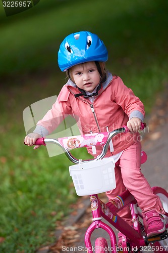 Image of little girl with bicycle