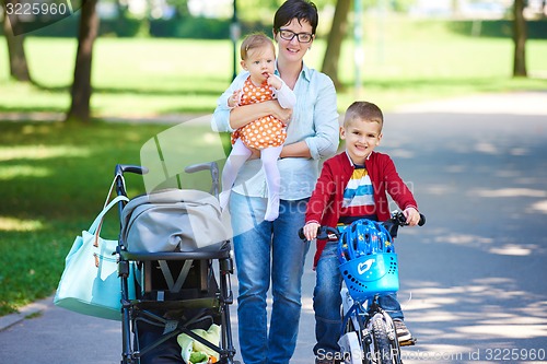Image of happy young family in park