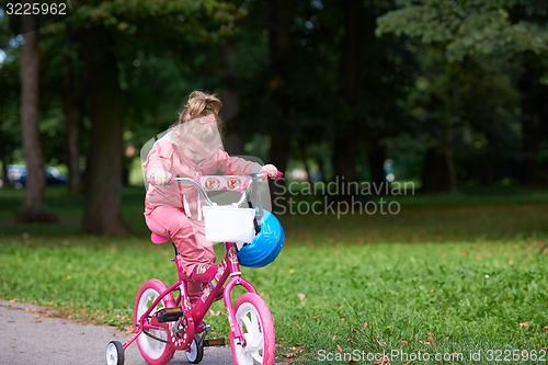 Image of little girl with bicycle