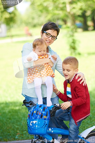 Image of happy young family in park