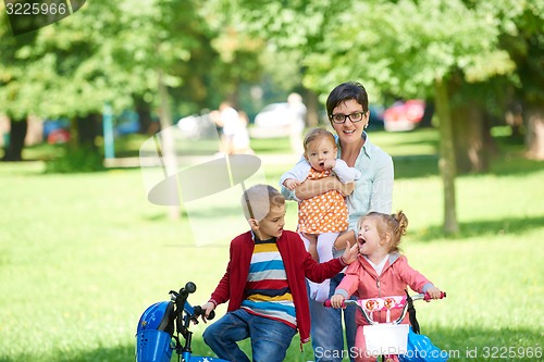 Image of happy young family in park