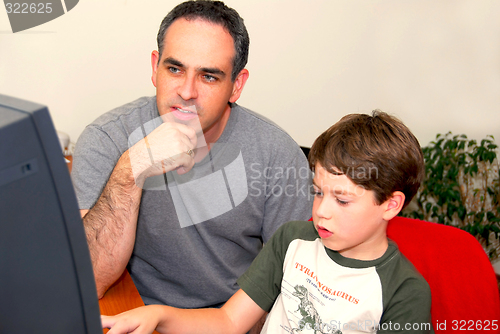 Image of Father son computer
