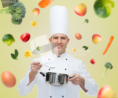 Image of happy male chef cook with pot and spoon