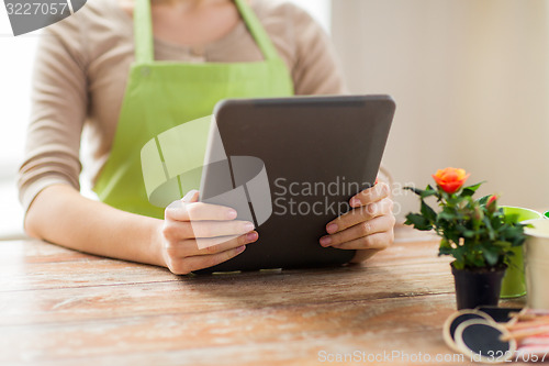 Image of close up of woman or gardener holding tablet pc