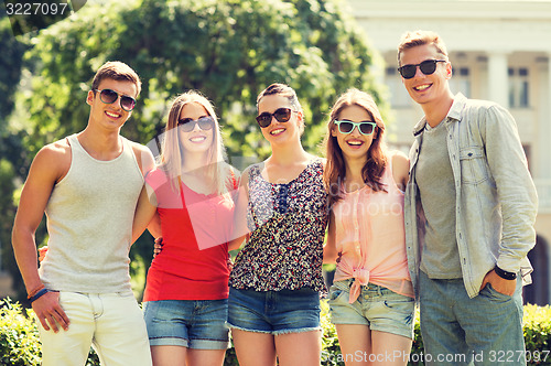 Image of group of smiling friends outdoors