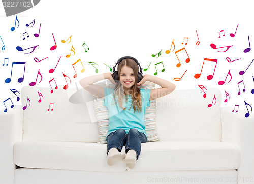 Image of happy girl in headphones listening to music