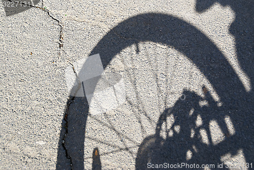 Image of The shadow of bicycle wheel
