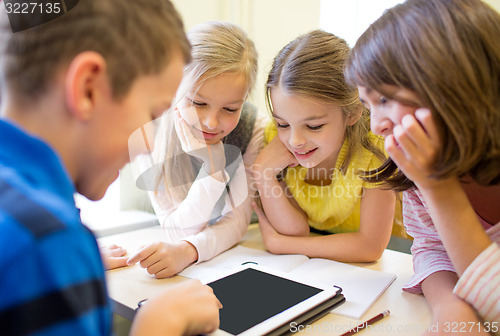 Image of group of school kids with tablet pc in classroom